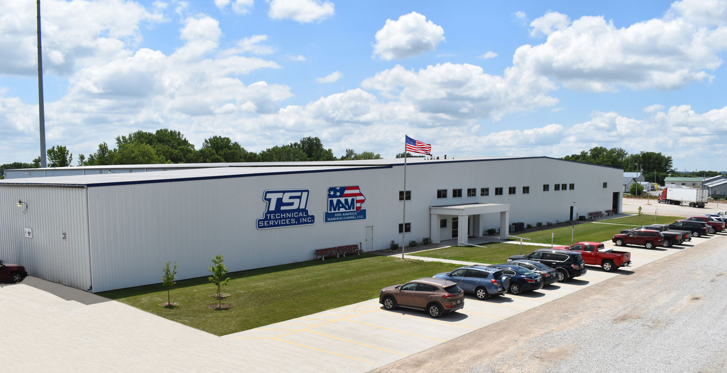 Aerial shot of TSI building on a sunny day with American Flag in front